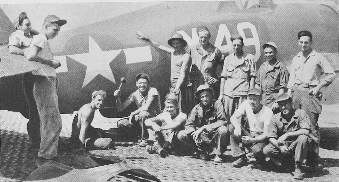 Senior Sergeant Axel Juhl standing in front of P-47 ‘X-49’ as number to from the left. In the front row from left are Kunst, Wilfred J. Mailhot, Robert P. Jackson, Melvin D. Solley, Robert C. Maratta and Bruno Palumbo, and in the back are John H. Bullock, Juhl, Johnson, Carlson, Jerico and James E. Davies.