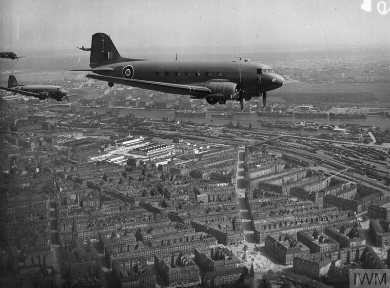 Douglas Dakota 'AY' above Enghave Plads in Copenhagen on 5 May 1945. It is likely, that the photo was taken as the aircraft had passed Copenhagen/Kastrup airfield from the south and was orbiting above the city before landing. The serial is not visible in the photograph, but according to the 512 Sqn operational record book this aircraft was KG368. © IWM(CL 2598)