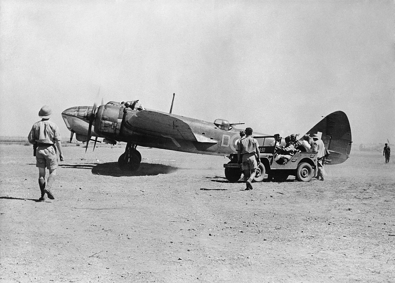 A Bristol Blenheim Mark IV of No. 45 Squadron RAF, on the ground at Magwe, Burma, while operating as part of 'X' Wing/'Burwing'. Note the jeep (right), borrowed from the American Volunteer Group, units of which were also based at Magwe in the closing stages of the first Burma Campaign