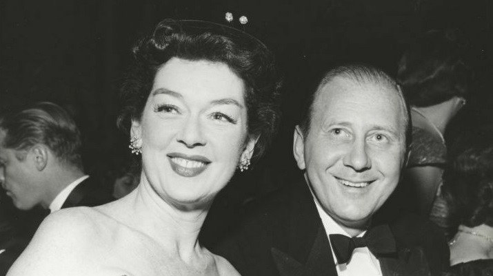 Frederick Brisson next to his wife, actress Rosalind Russell a charity event in March 1958.