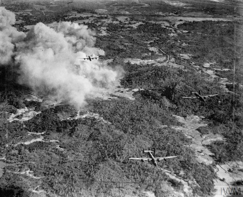Three Liberator VIs from 356 Sqn have just bombed Japanese positions on Ramree Island prior to the attack on 21 January 1945 (© IWM C 4940)